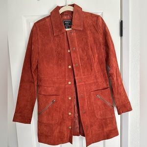 Rust colored suede jacket with vintage vibes